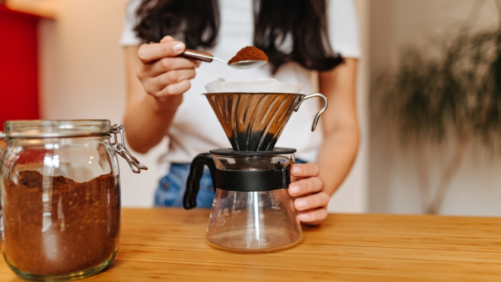 picture-of-girl-pouring-teaspoon-of-ground-coffee-2023-11-27-05-37-21-utc.jpeg